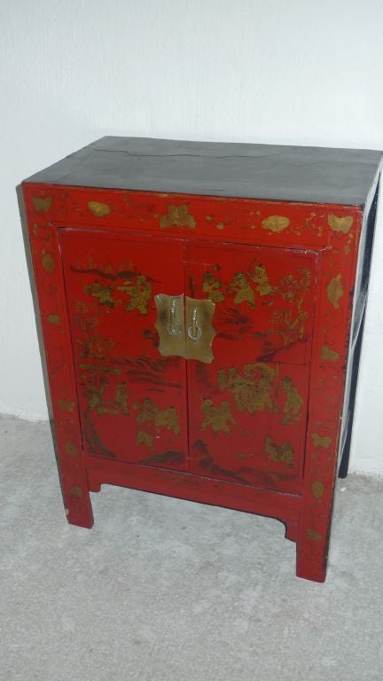 A Chinese red lacquered nightstand with 