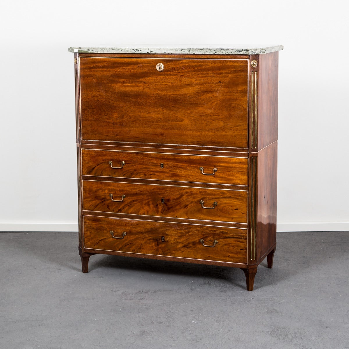 A beautiful mahogany secretary made in Sweden during the late part of the Gustavian period ca 1790-1810. The secretary is veneered with mahogany and decorated with simple brass details and hardware. Interior with several drawers and compartments.