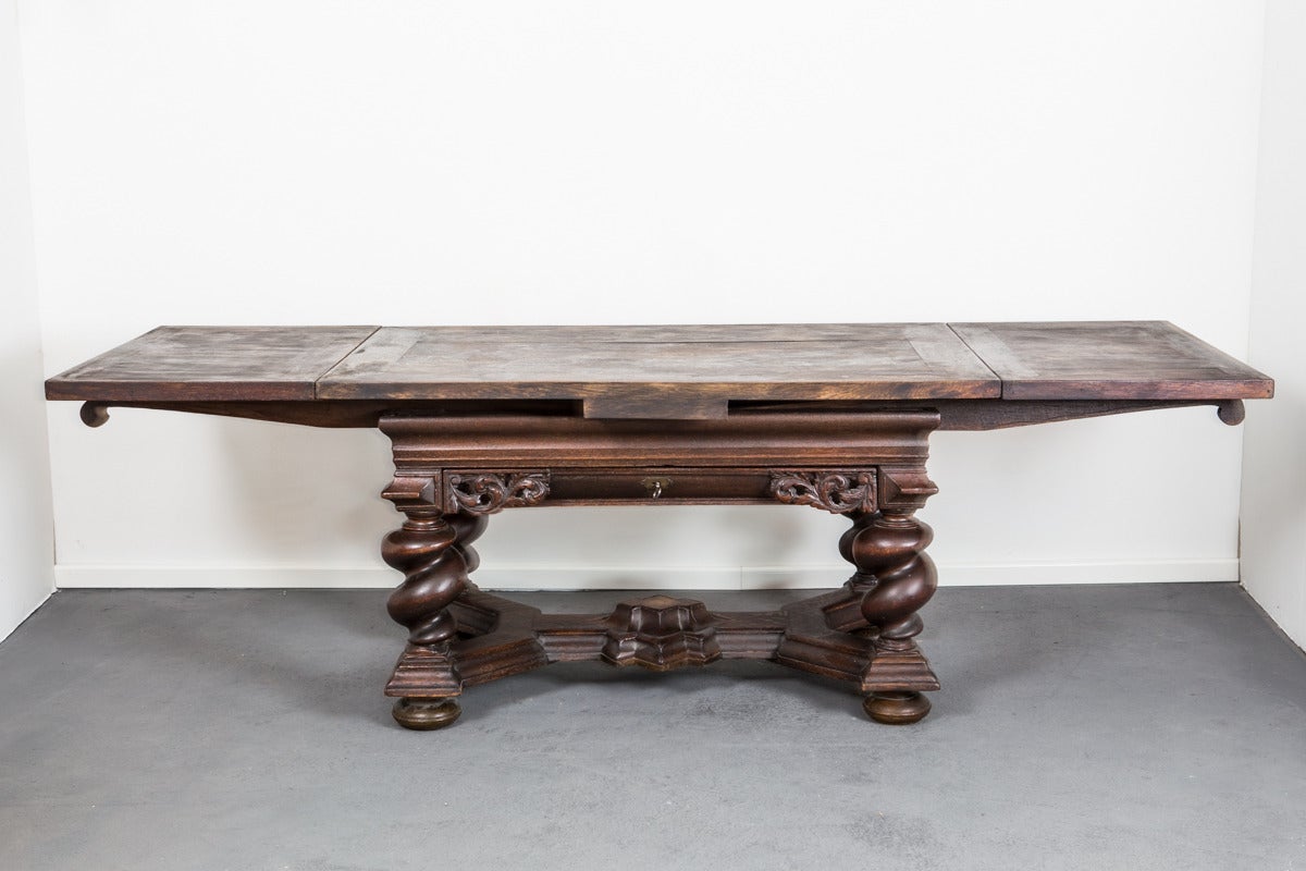 Library Table Swedish Baroque oak period, 1650-1750, Sweden. A large table made during the baroque period in Sweden, 1650-1750, with two pull-out leaves, each 21.6 in long. Original hardware and key. Base with four serpentine legs connected with a