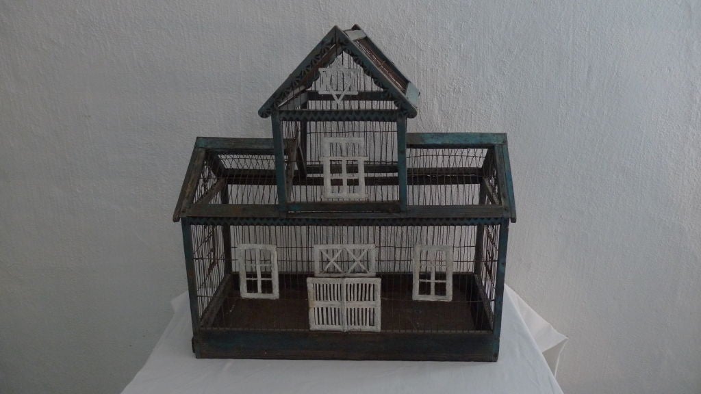 A rare bird cage built as a synagogue decorated with the Star of David in painted wood and metal.