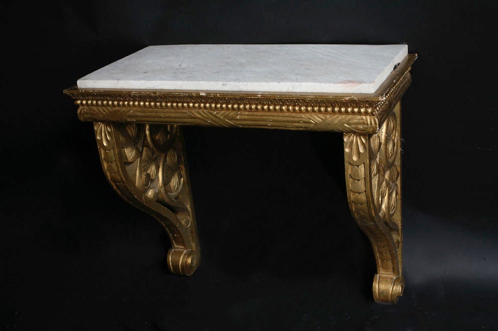 A Swedish console table made in gilt wood. Base in carved wood and then gilded with a cararra marble top. Have a matching mirror with reference# Ref. : U1109128829430.