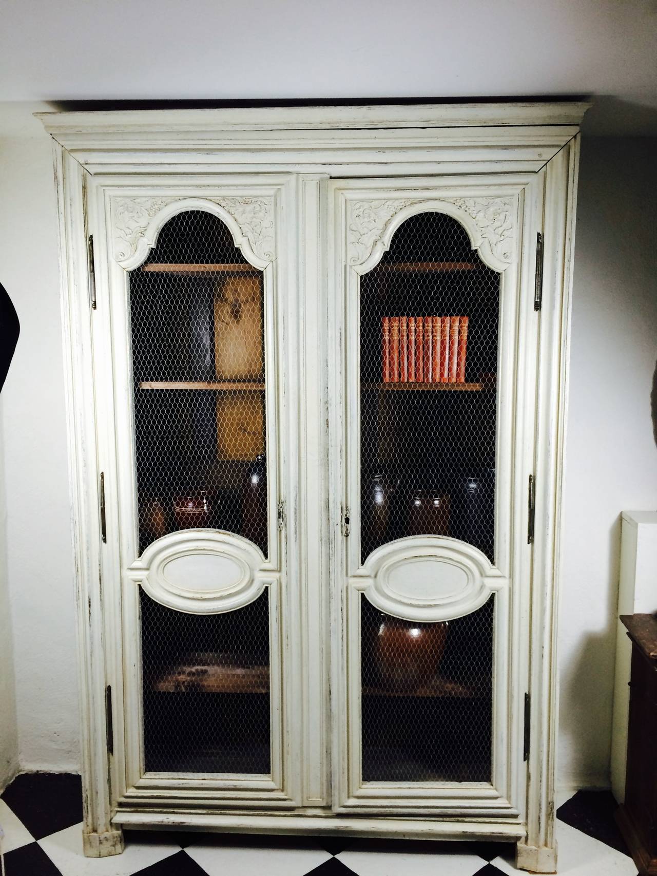 A very pretty cabinet made in France, circa 1800 in painted oak. Later painting and later chicken wire.