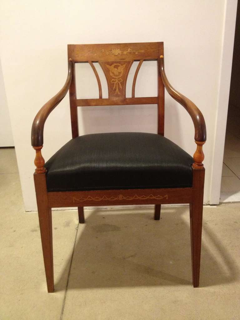 Set of 4 lovely Danish chairs with light birch inlays in back and front frieze. Newly upholstered.