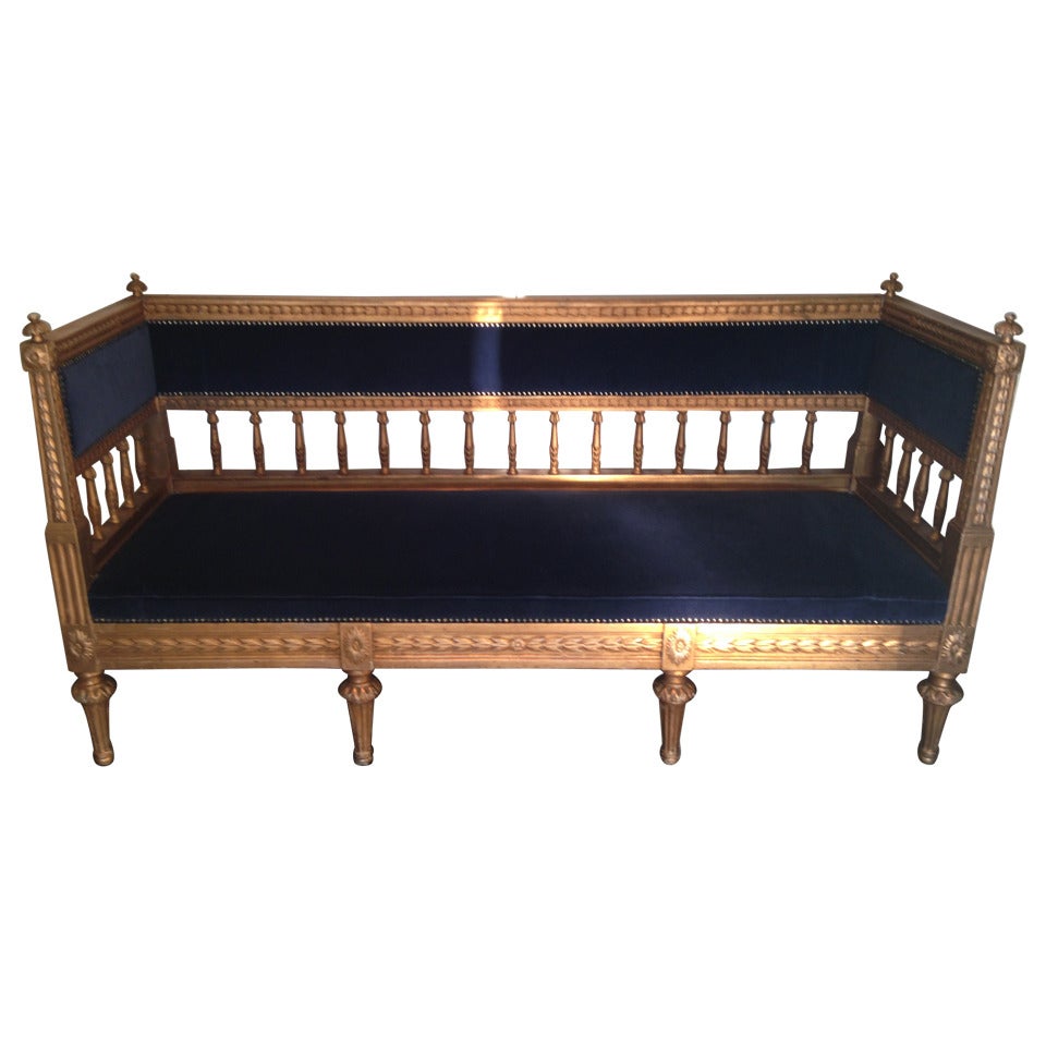 Sofa Swedish gilded Gustavian or neoclassical, 18th century, Sweden. A beautiful gilded Swedish sofa from the late Gustavian period, 1790-1810. Upholstered in a dark blue velvet.