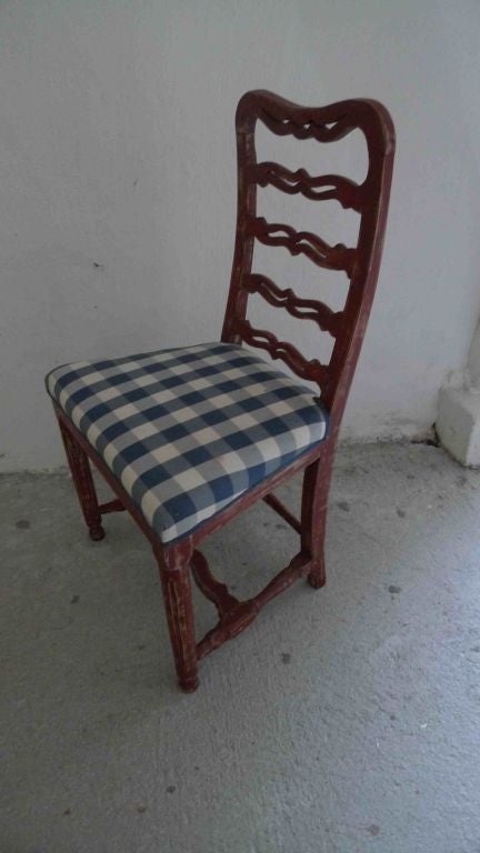 A set of amazing Swedish red painted ladder back chairs in 