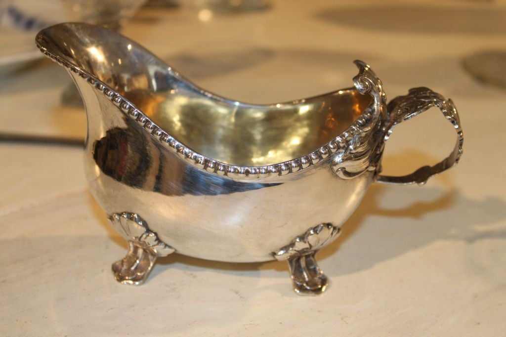 Beautiful Swedish Rococo saucer standing on 4 legs. Decorated with pear beading and leaves.