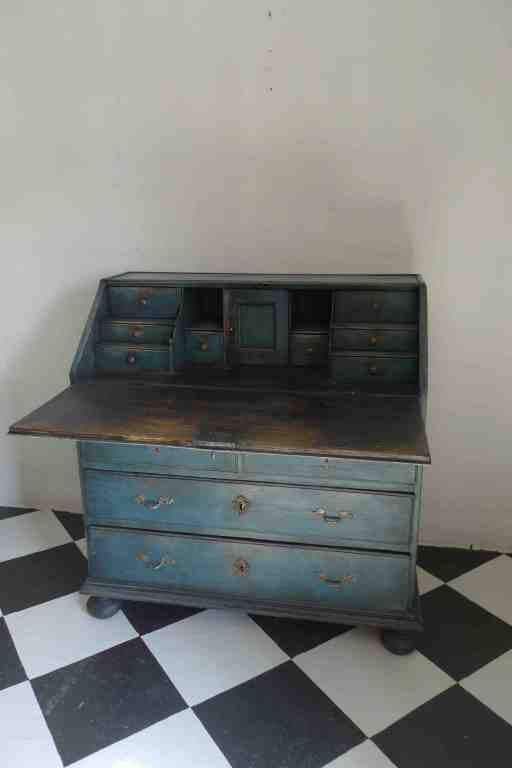 A lovely little secretary in a dark blue paint with a darker almost black interior. All original.