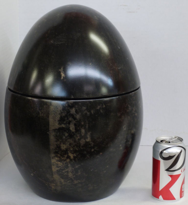 Spectacular surrealist egg shaped Ice Bucket by Aldo Tura.  Constructed of Goatskin Parchment over a hardwood structure.  Reminiscent of the egg shape bottle rack in Xavier Lalanne-designed bar for Yves Saint Laurent.  