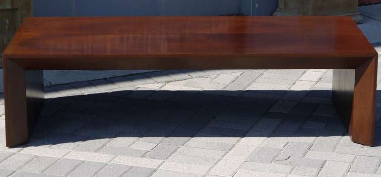 Stunning clean lined jacaranda wood under lacquer coffee table with a beveled edge and mitered corners finished.