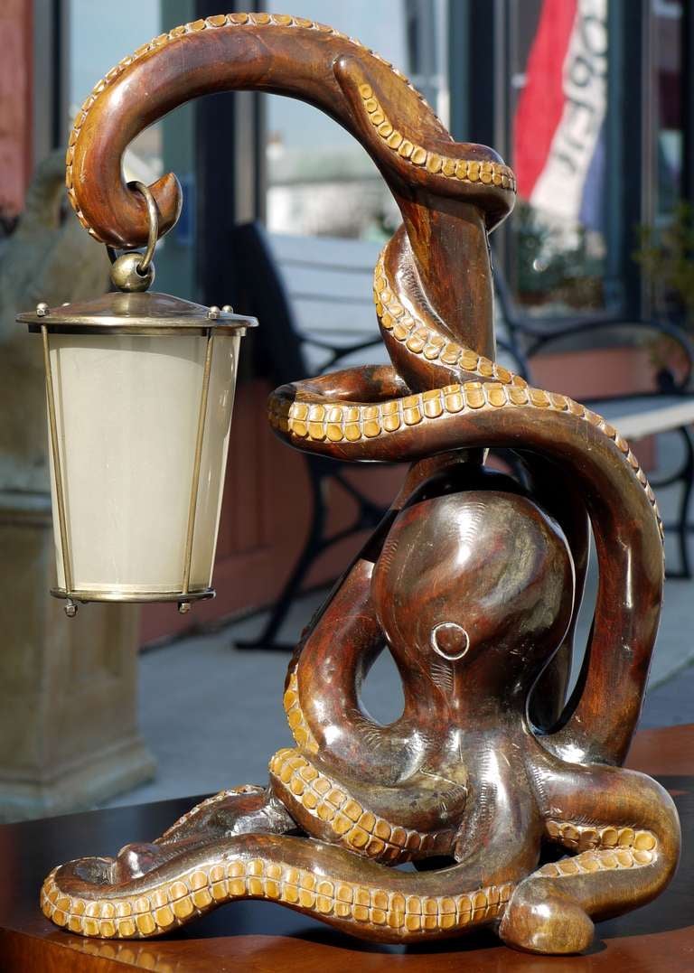 Not many Aldo Tura pieces can compare to this Octopus lamp with it's entwined arms with one arm held up to light it's way.  This is most likely a unique protoype lamp.  Aldo Tura lamps were done in small editions and the detail and level of