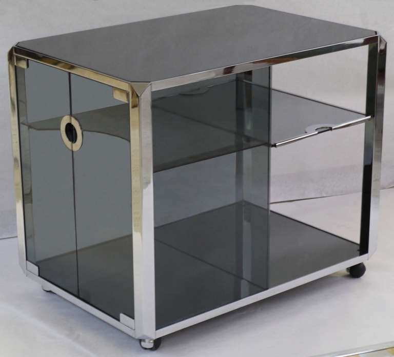 Sleek grey glass bar cart with heavy chrome appointments. The attention to details on this bar cart are second to none. Design is often attributed to Mario Sabot, Italy. 
