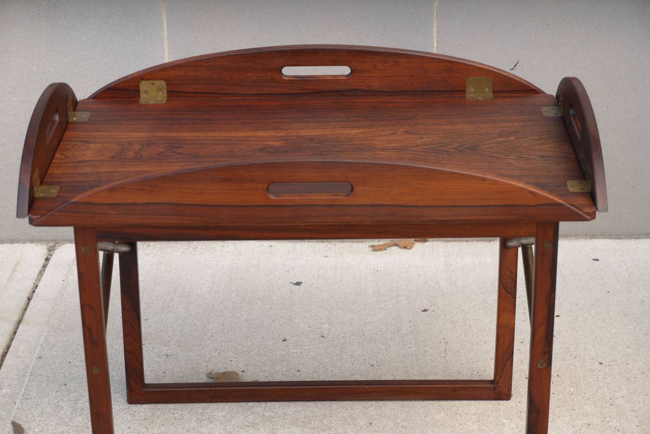 Svend Langkilde butlers tray table in rosewood and brass produced by Illums Bolighus in Denmark. The tray is removable from the base.
