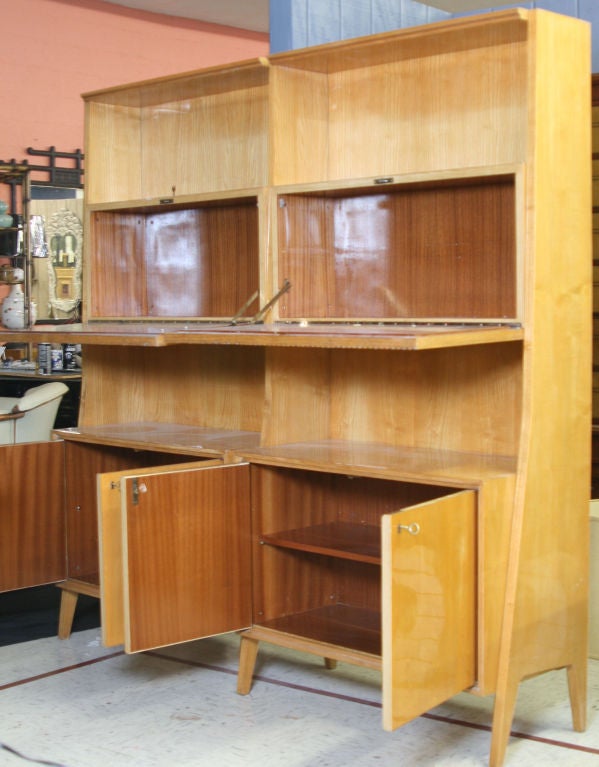 Stunning bookcase or wall unit in the style of Gio Ponti. Constructed of lacquered fruitwood and an ingenious modular design.  I have matching desk which came from the same place.