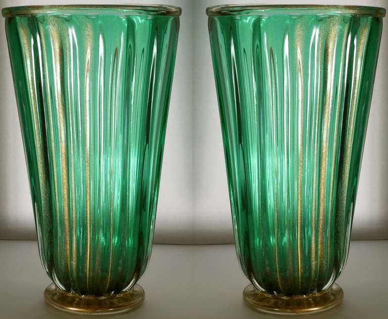 Stunning large pair of murano vases by Ramono Dona in green glass with 23k gold inclusions.  Similar in color and shape to pieces by Seguso.