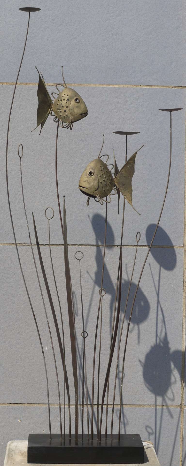 Wonderful kinetic fish sculpture by Ruddolph Turnbull an artist from Woodstock, New York.  It is constructed out of brass which is formed and then hand brazed together.  Fish are constructed from sheet brass and are meltcoated with brass for added