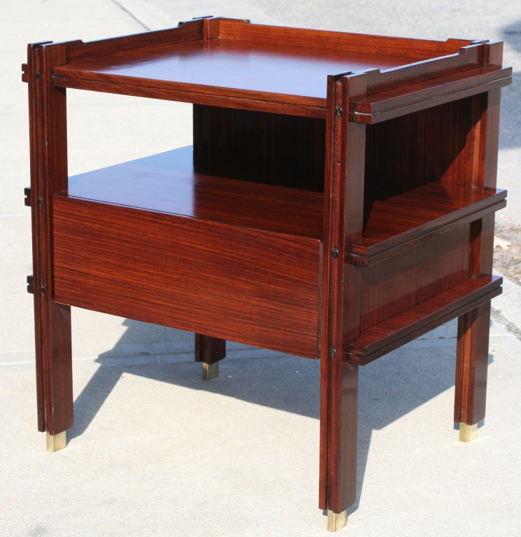 Stunning pair of architectural rosewood bedside tables attributed to Ico and Luisa Parisi.  Tables have a single drawer with solid mahogany.  Back is finished in rosewood.