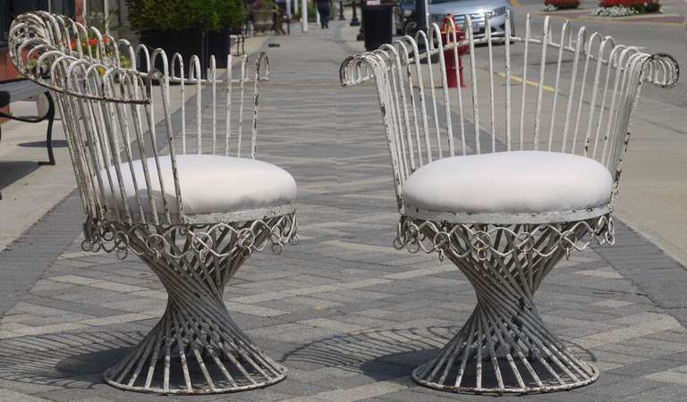 Rare pair of side chairs by Mathieu Matégot, these are a little larger scale than the ones which go around the table.  In original condition these can be restored upon request.  These have been left as is due to a flood of reproductions hitting the