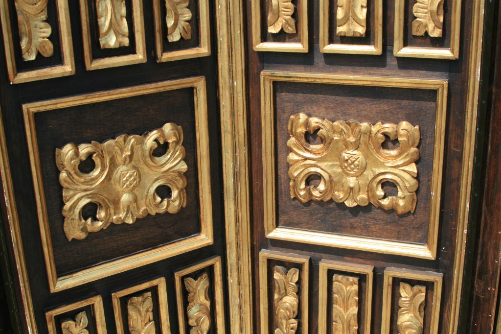 Pair of breathtaking Carved and Gilt Screens similar in style to pieces used by Tony Duquette.  They can be used in a contemporary, a modern, or a traditonal house with ease.  Pushed together they make a large screen which adds texture to a room, or