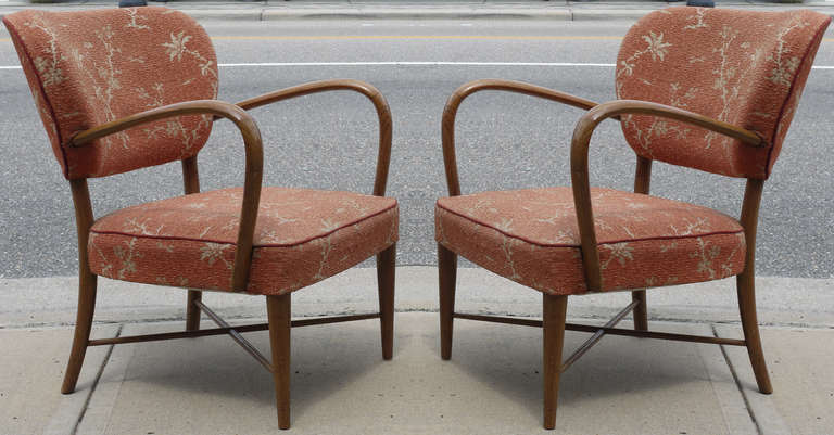 Stunning French oak chairs done in the style of Jean Royere.  Wonderful gentle lines, and flared back legs and cross bars.  The fabric is original and in excellent shape and it is an asian style cut boucle and the cording appears to be silk.