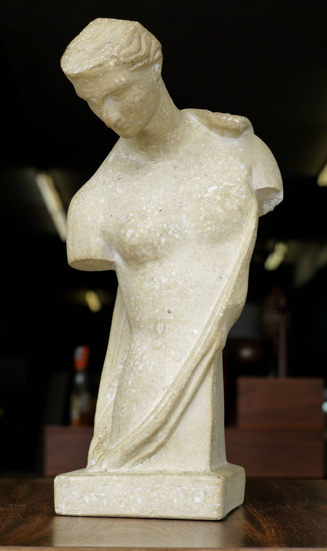 A wonderful 1930s-1940s Italian Art Deco sculpture made from terrazzo. Kinda surrealistic look to the figure with the flattened head. Very stylish figurine or bust.