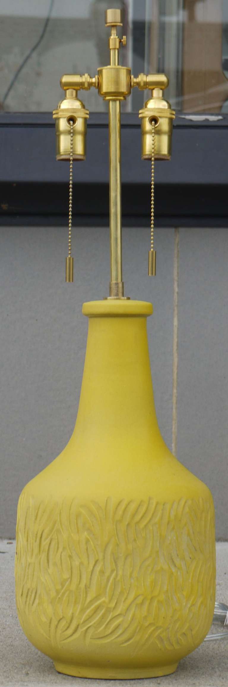 A crazy banana yellow table lamp designed by Lee Rosen for Design Technics.  Signed on reverse above cord.