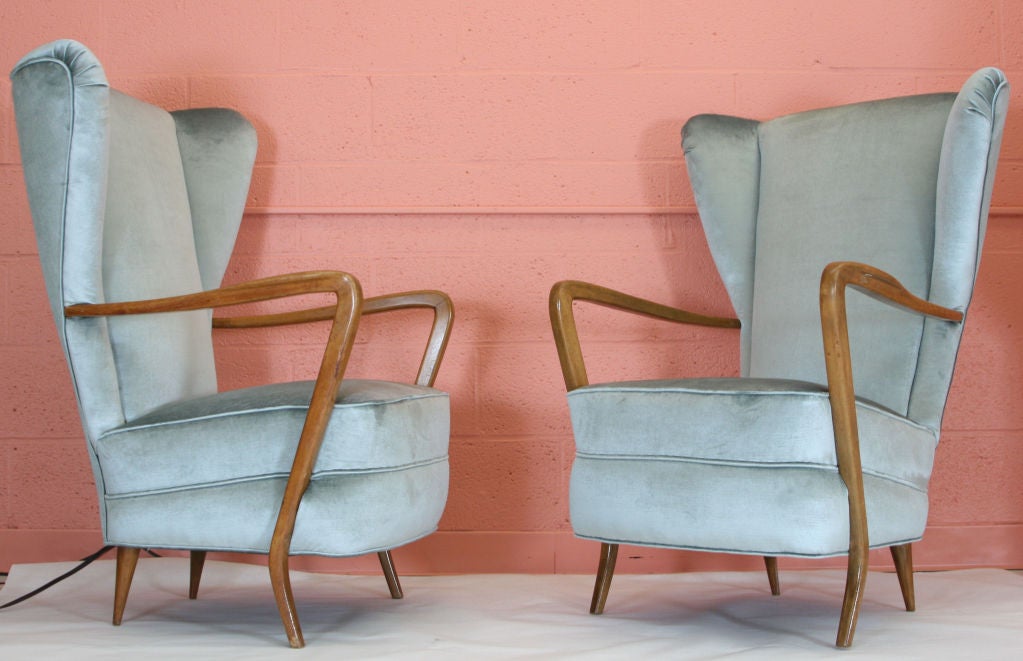 Pair of high style wingback chairs designed by Paolo Buffa. Upholstered in a very Fine silk velvet. Love the almost surrealistic quality to these. Matching settee is also available.