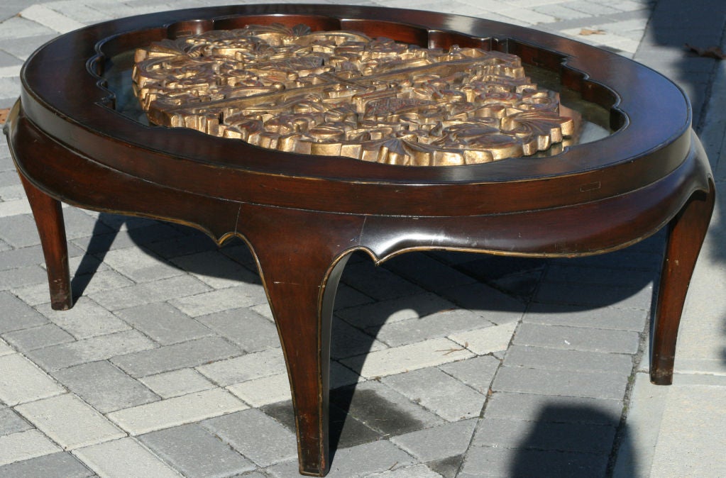 Superb Lacquered Mahogany Coffee table with inset gilt plaster relief on oxidized mirror insert finished with a glass top.  See Wright20 Important Design Auction, December 15th 2011 lot 326 for a similar example.
