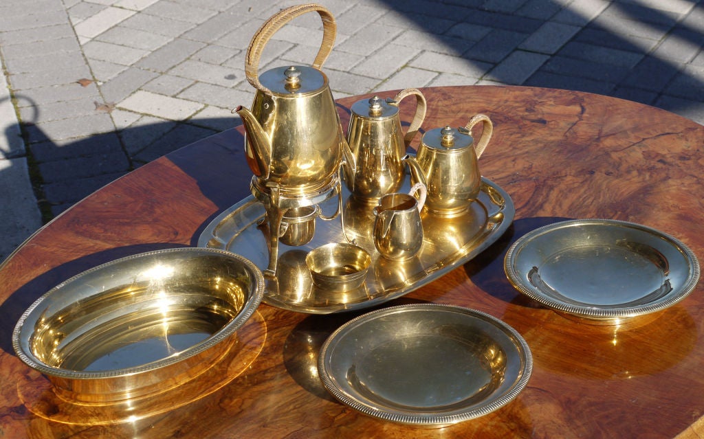 Vermeil over Silver Plate tea set by gift and luxury company Kirby Beard & Co of Paris.  Featuring a heated Coffee Pot, Chocolate Pot, Tea Pot, Cream and Sugar, a Bread Bowl and two footed compotes.
