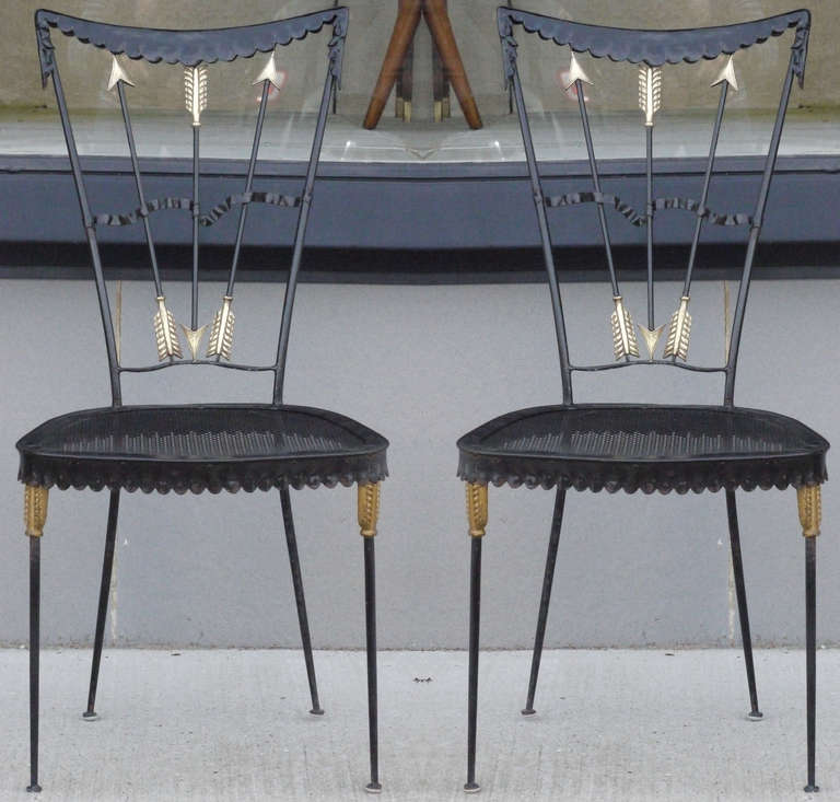 Wonderful pair of Italian iron chairs with brass appointments by Tomaso Buzzi, circa 1940.