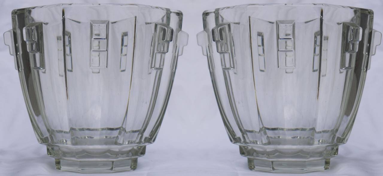 Luxurious pair of faceted Art Deco vases manufactured, circa 1935 in the Czech Republic. These stunning vases are of the highest quality, made out of very thick crystal, featuring a receding octagonal design on which stepped glass details adorn each
