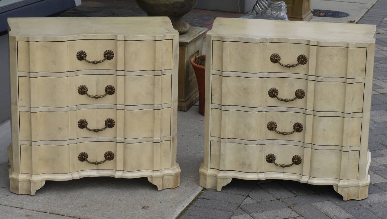 Stunning pair of scallop front dressers by Quigley and finished in Marx's signature faux finish. Wonderful scale as they could be used on either side of a bed.