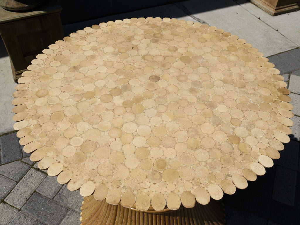 Stunning sculpted rattan dining table base made to look like a sheaves of wheat pulled together in the center made by Mcguire furniture in the 1970s.  We had the top filled and then sanded down and lacquered so the table can be used without a glass
