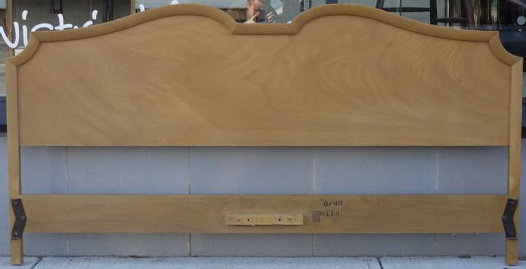 Early headboard by Robsjohn Gibbings for Widdicomb dated 1949.  Beautiful grain on the walnut visible through the bleached finish.  Has the original frame which connects on the corners.