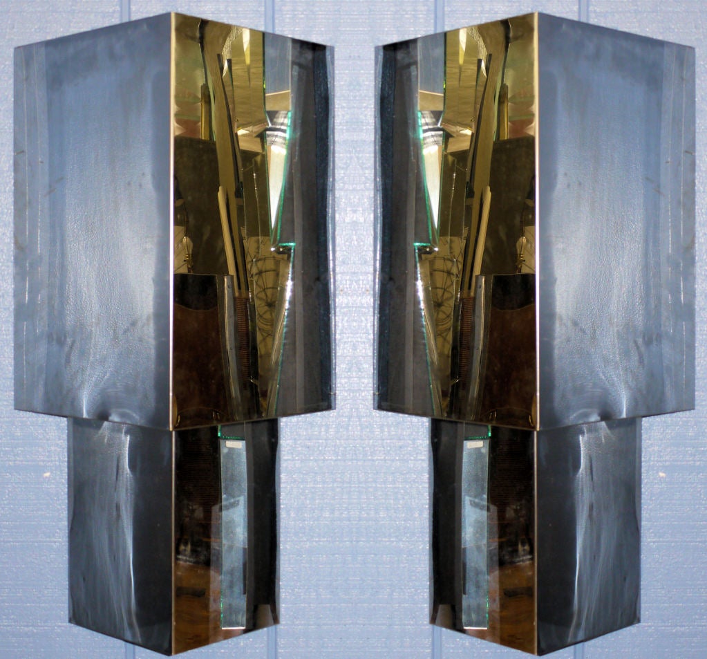 Large pair of nickel plated Architectural sconces circa 1970, similar in style to pieces by Curtis Jere, and Neal Small.  Wired with a pull chain switch on the bottom.