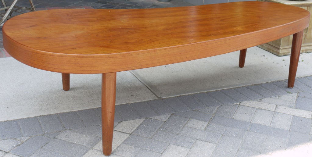 A massive amoeba shaped or biomorphic teak coffee table by danish cabinet maker Poul Dinesen.
