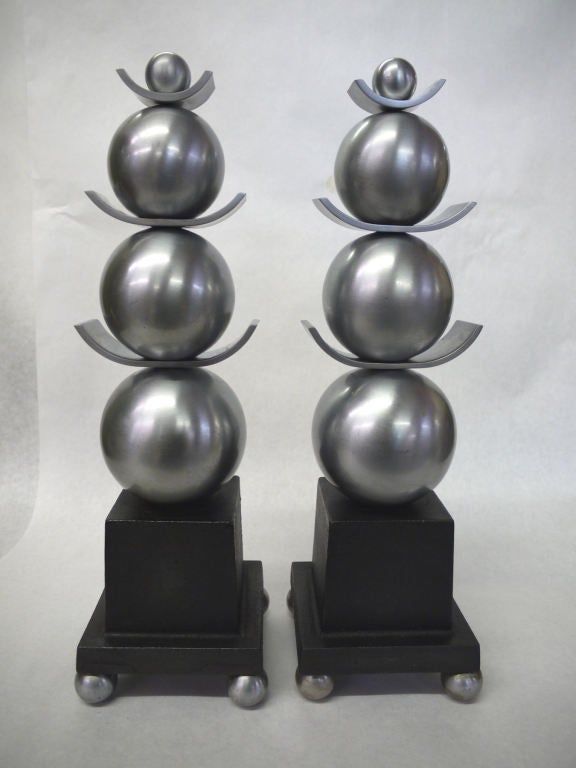 Spectacular pair of stacked sphere andirons in constructed of brushed nickel plated brass and cast iron base.  Made by the Wm. H. Jackson of New York in the mid 1930s.
