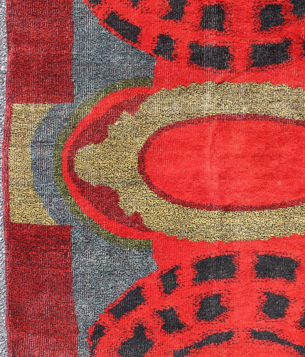 Art Nouveau Design Rug from the Mid 20th Century in Red, Green, Blue & Black .
This rug reinvents an aesthetic design that evokes a modern pattern. A dramatic blend of reds, oranges, and black contrast with lighter colors to create a distinctively