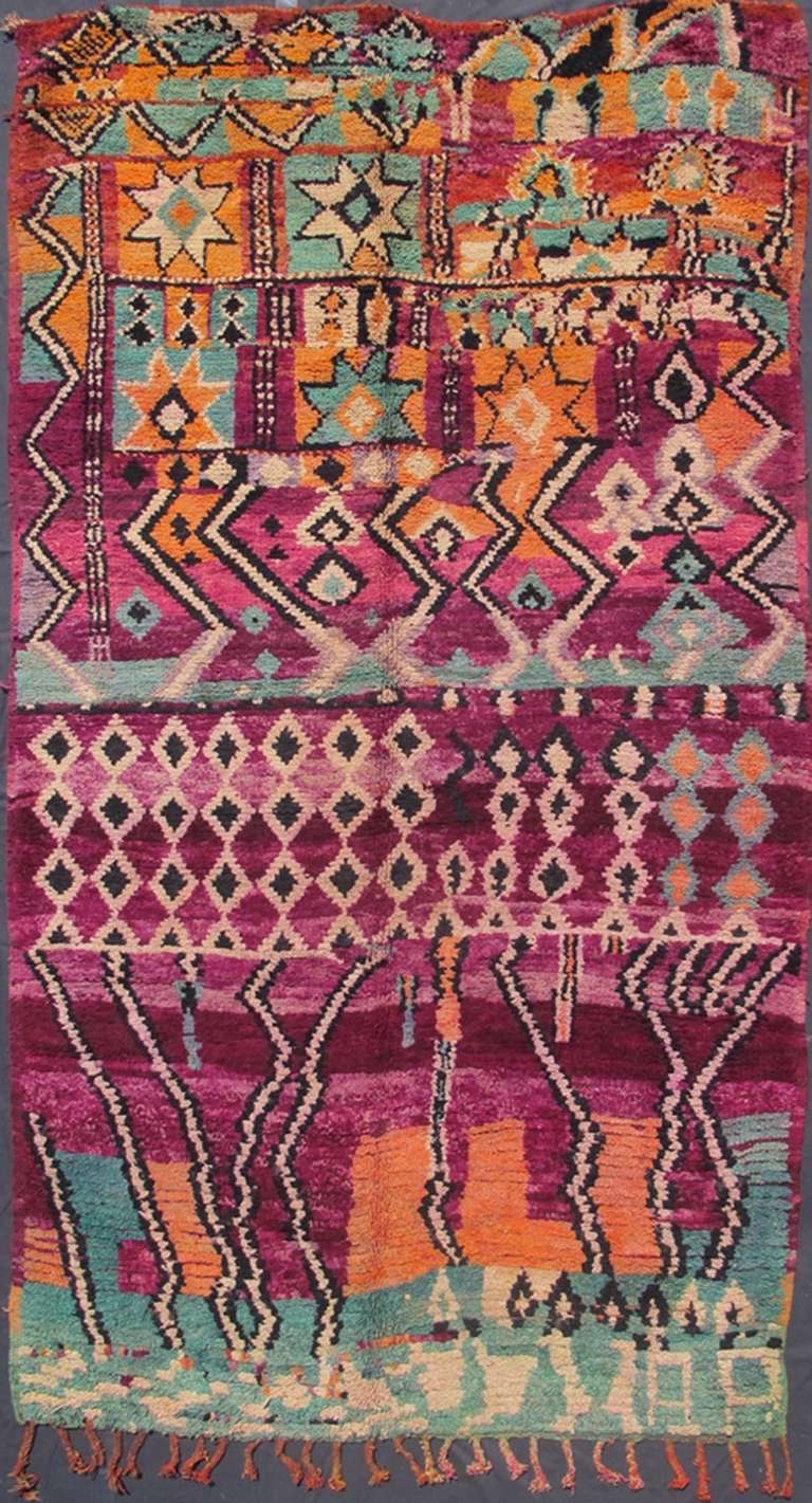 Rendered in diamond shapes with spotted and speckled assortment of rich colors, this very unique Moroccan has an abstract feel in design with colors that change randomly. With an artistic and original village weaving from high Atlas mountain this