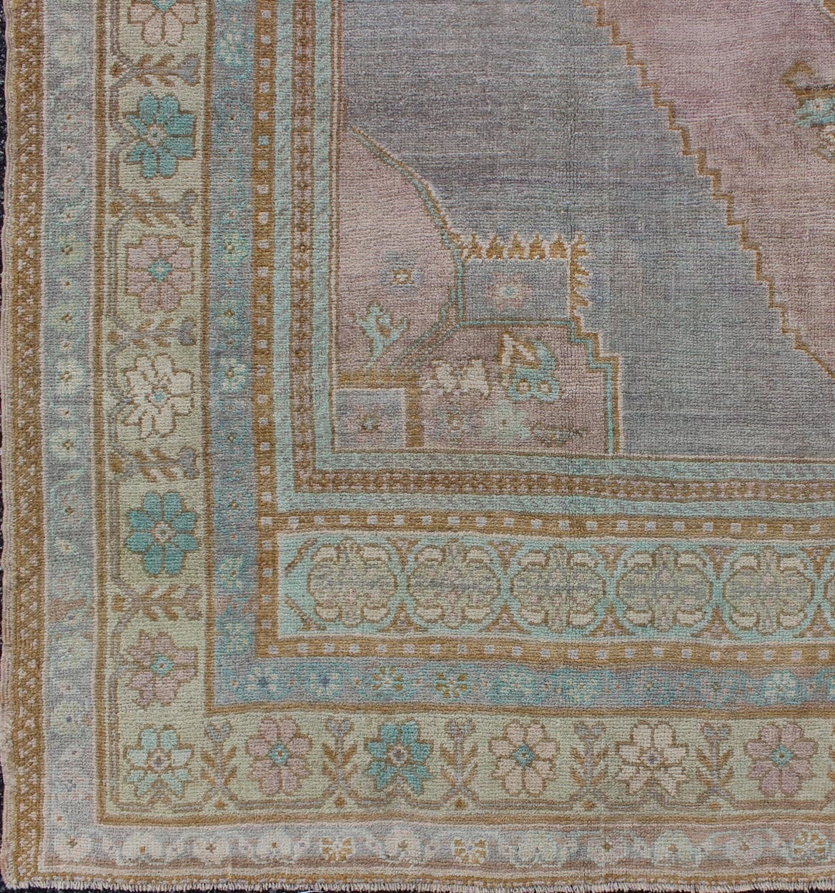 This vintage Oushak rug beautifully integrates neutral compositions to decorate a calm and serene room. The multi-shaded colors of lavender, blue, gold, taupe, green, purple and ivory spread throughout the rug.
Measures: 7' x 10'4.