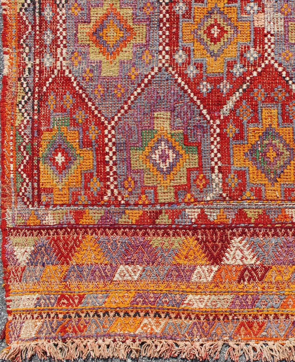 Vintage Embroidered Flat Weave Jajeem Jijim Rug with Geometric Diamond Design.
Rendered in star shapes with a spotted and speckled assortment of geometric elements, this unique mid-century Jajeem showcases an array of rich colorful tones that have