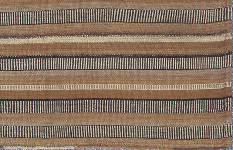  Antique Kilim in Vertical Stripes in Gray, Light Brown, Black, Ivory and Camel Colors.

Measures: 5'8 x 8'11.

 Antique paneled Kilim with fairly thick body in textured brown, camel, mocha, black, ivory and gray. Keivan Woven Arts/ rug/