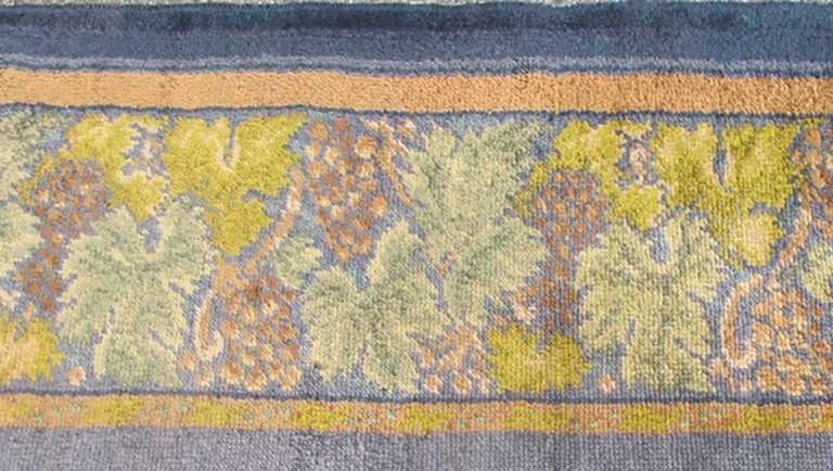 Antique Donegal Carpet from Ireland in solid Purple Background and Floral Border in square size.  Keivan Woven Arts  Rug/ HAS-3327. Donegal rug, Antique Donegal.
        
Measures: 10'6 x 10'10.

Made in Ireland, this beautifully crafted Donegal