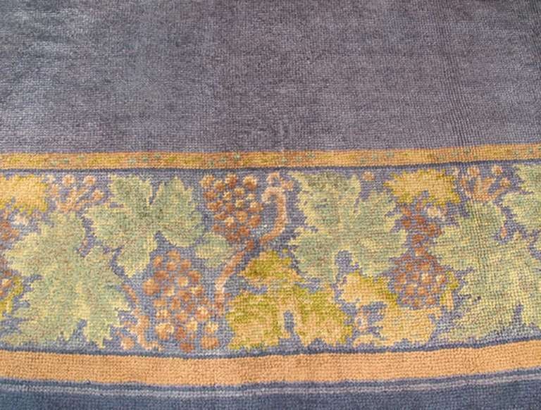 Arts and Crafts Antique Irish Donegal Carpet in solid Purple Background and Floral Border