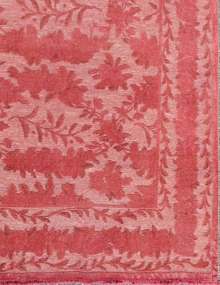 With an allover sub geometric boteh of flowers, this charming large rug has rose color background. 12'1 x 15'5