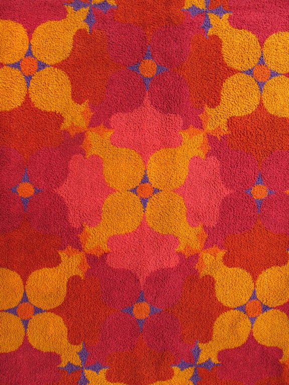 This Vintage European Carpet beautifully illustrates the Bold and Colorful period of what has come to be known as Mid Century Design.  The Daring Palette is comprised of Deep and Medium Reds, Audacious Blue, Tangerine Orange, and Coral Pink. 