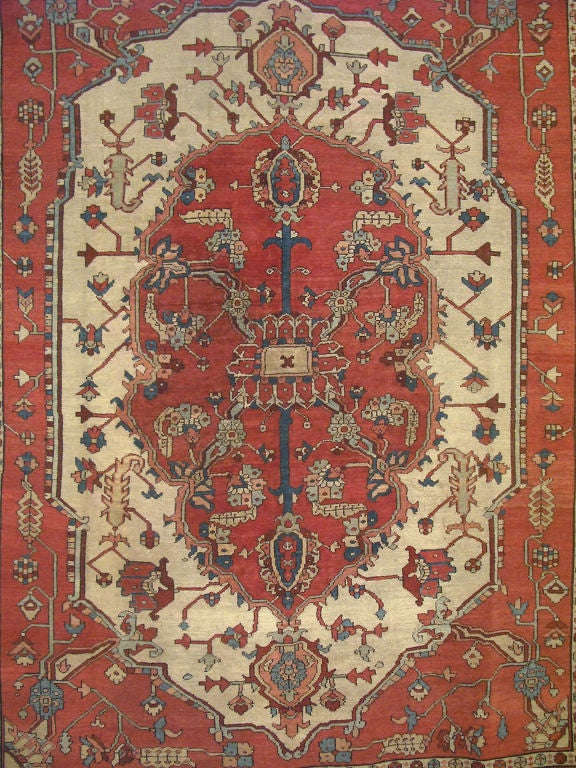 With an adaptation of ancient weaving, Serapi carpets are prized for their fine craftsmanship and good taste. This very finely woven antique Serapi rug represents the finest of Serapi carpets in terms of quality, workmanship, colors and artistry.