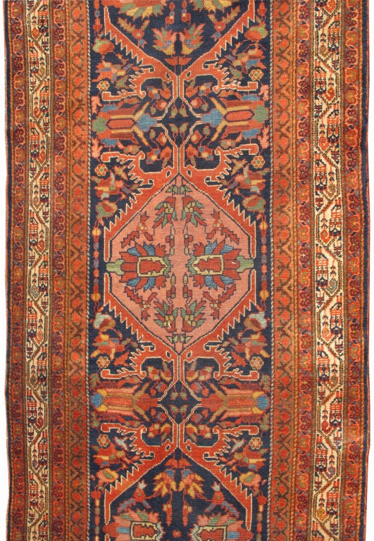 Antique Persian Malayer Runner in Navy Blue Background
This lovely Antique Persian Malayer runner originates from the northwest region of Persia around the turn of the 19th Century. It bears a beautiful, traditional color palette and all-over