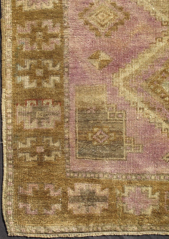 This unique Oushak runner features an ornate pattern inspired by tribal designs. The colors, such as lavender and green, coordinate well with red and cream to decorate this runner with a most unusual color combination. Simply gorgeous!
Measures:
