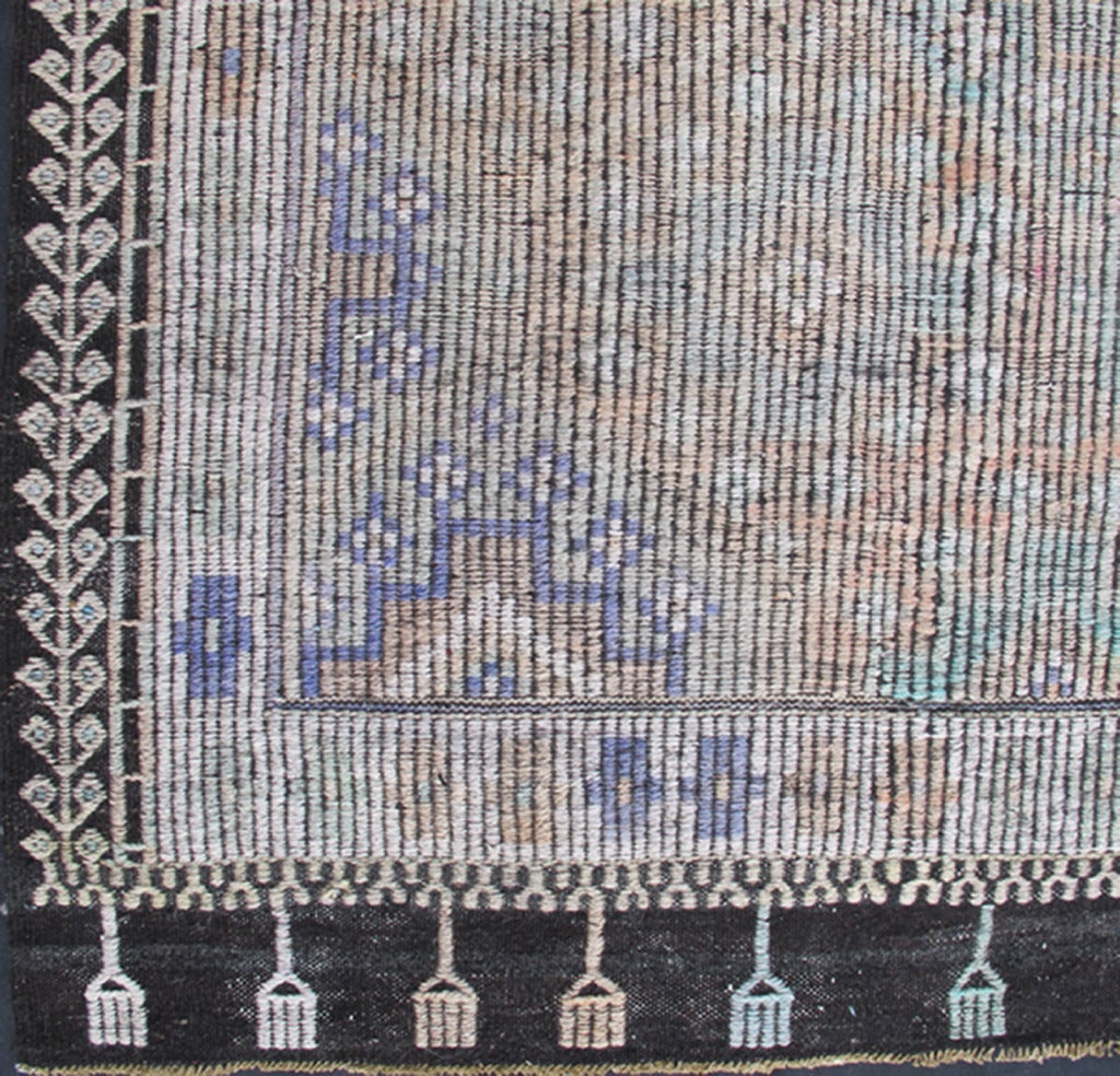 This vintage Jajeem features a central repeating diamond pattern complemented by a Greek key design in the border. The fair, pastel colors include light green, light blue, ivory and light camel. 
Measures: 6.3 x 12.9.

  