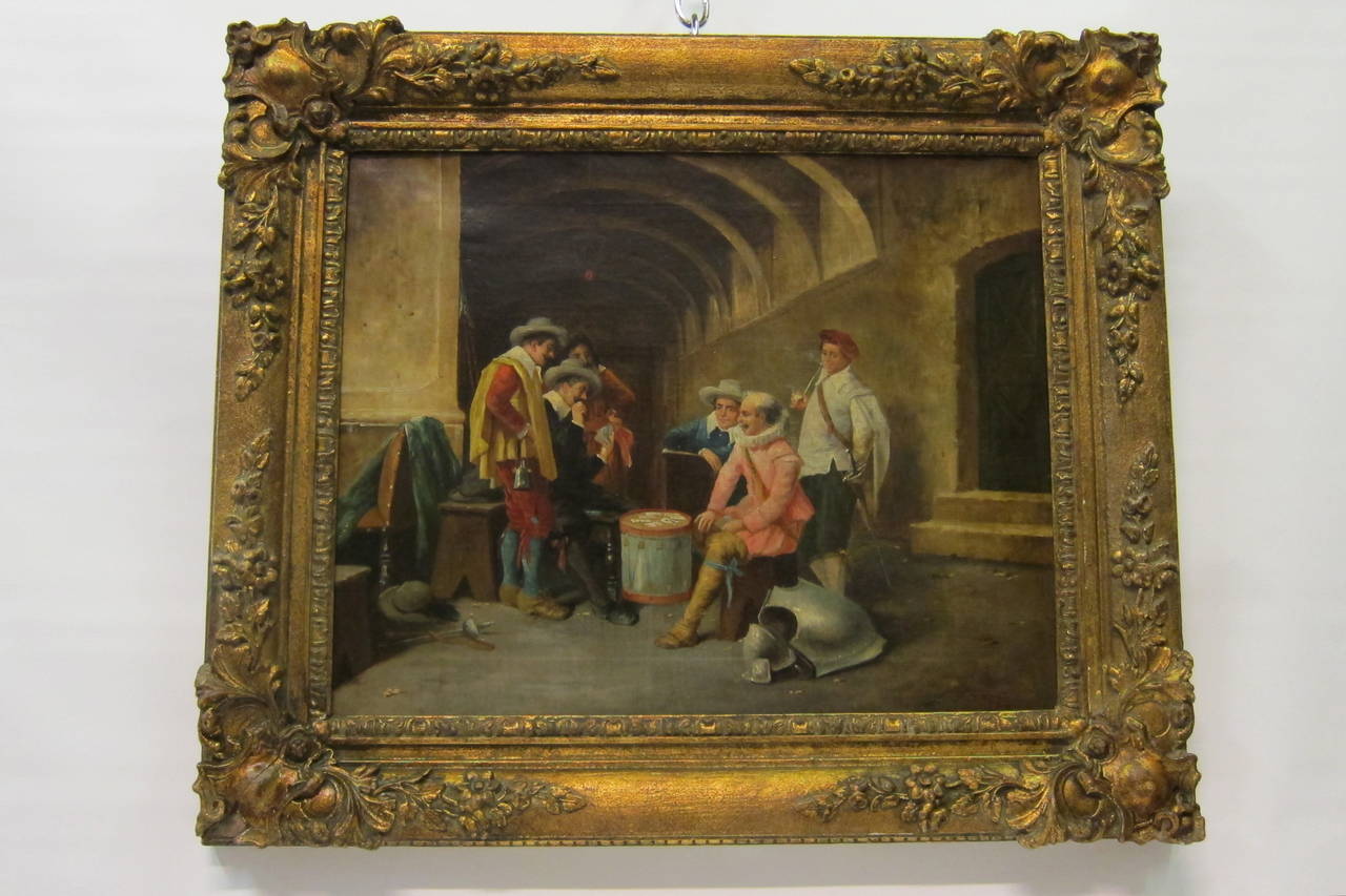 This vintage, late 19th century oil painting on canvas is framed in a renaissance gold colored wood & gessoed frame. The painting displays colorful continental gentry characters rendered relaxing around a drum on which they are playing cards.
The